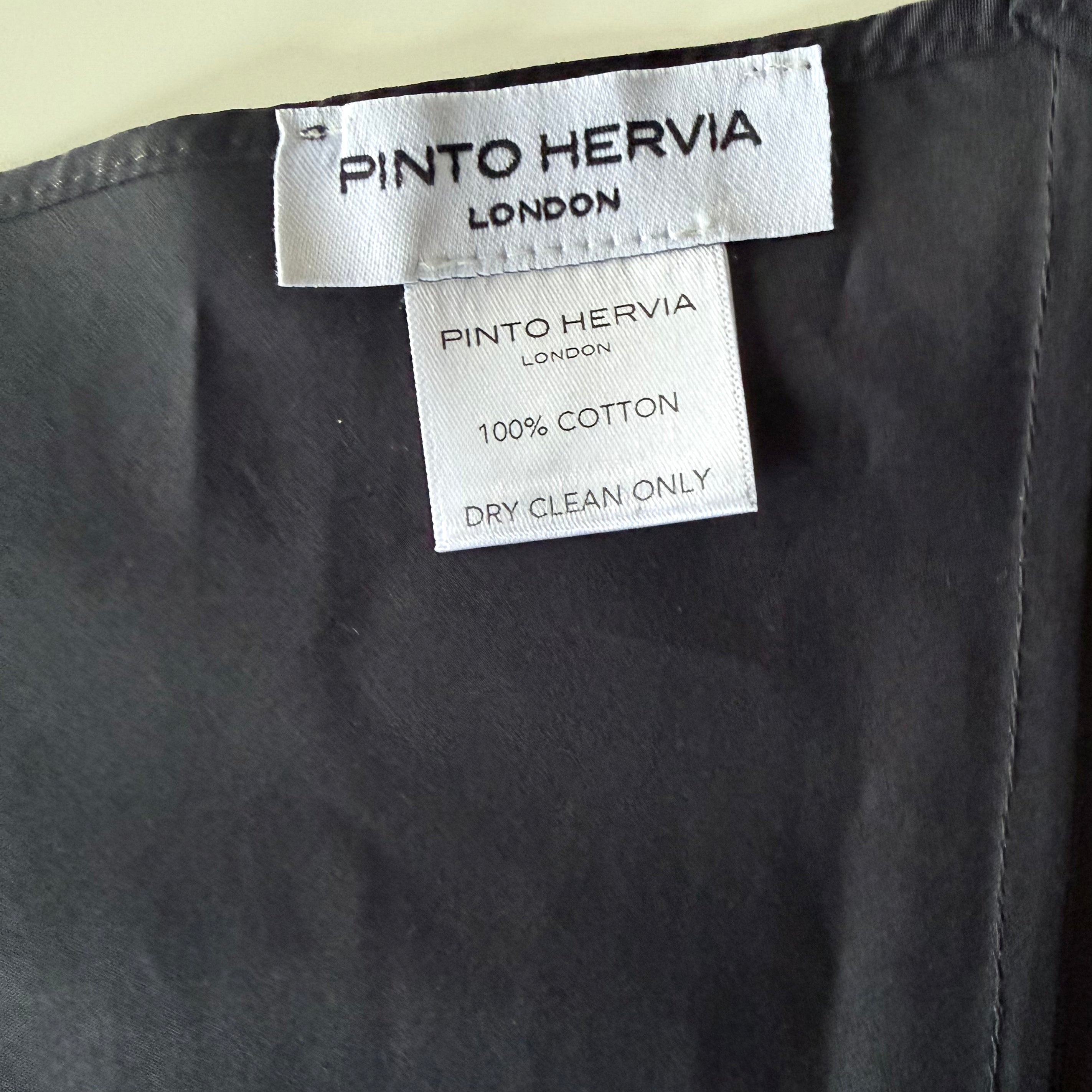 Close-up of structured seam detail and matte poplin finish on black Arrombo Scarf