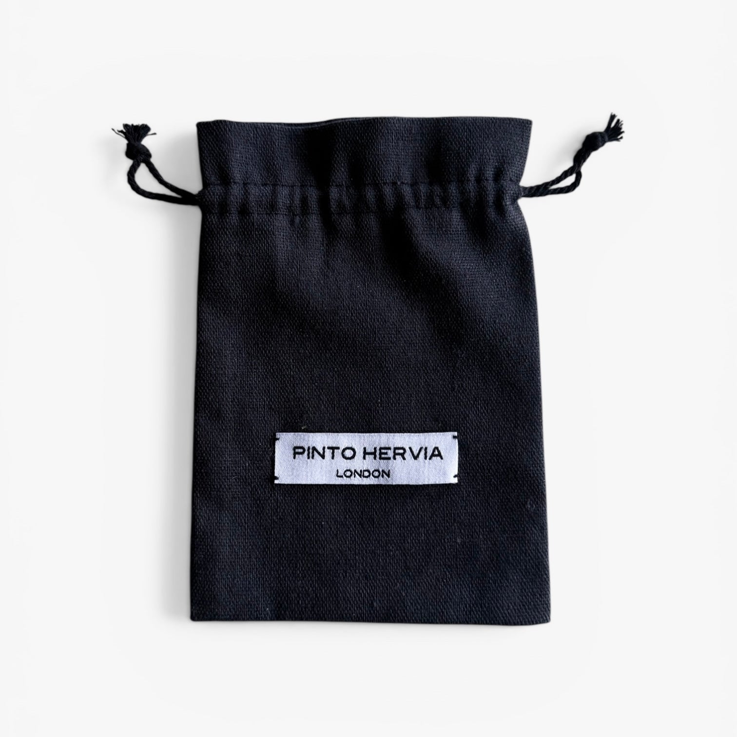 Black fabric pouch with drawstring featuring the label PINTO HERVIA LONDON.