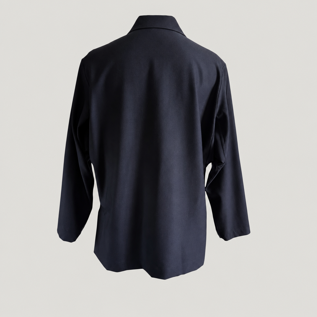 Back view of the PINTO HERVIA Frame Jacket in black wool with relaxed silhouette and clean rear