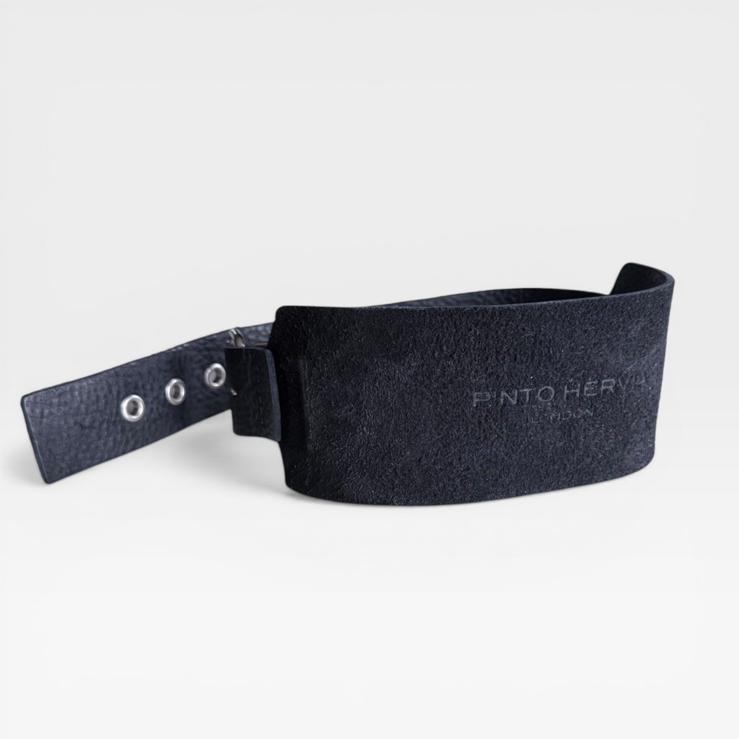 Black leather cuff bracelet with embossed Pinto Hervia logo detail