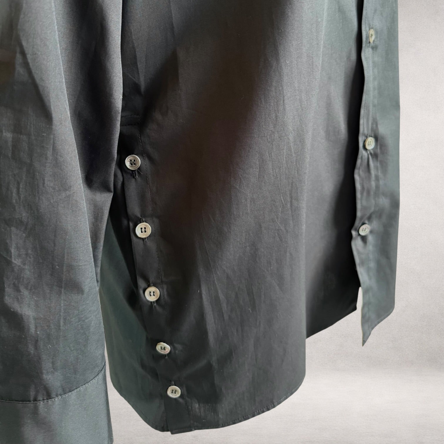 Black Aries 6 shirt detail showing side button fastening