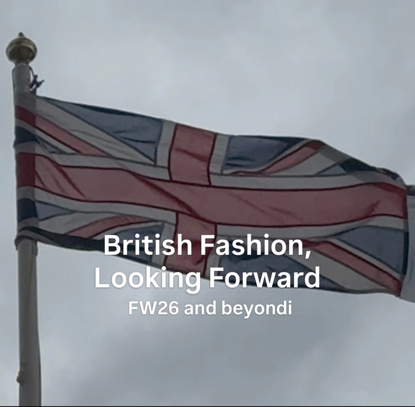 Union Jack flag waving against a grey sky with overlaid text reading “British Fashion, Looking Forward – FW26 and beyond”