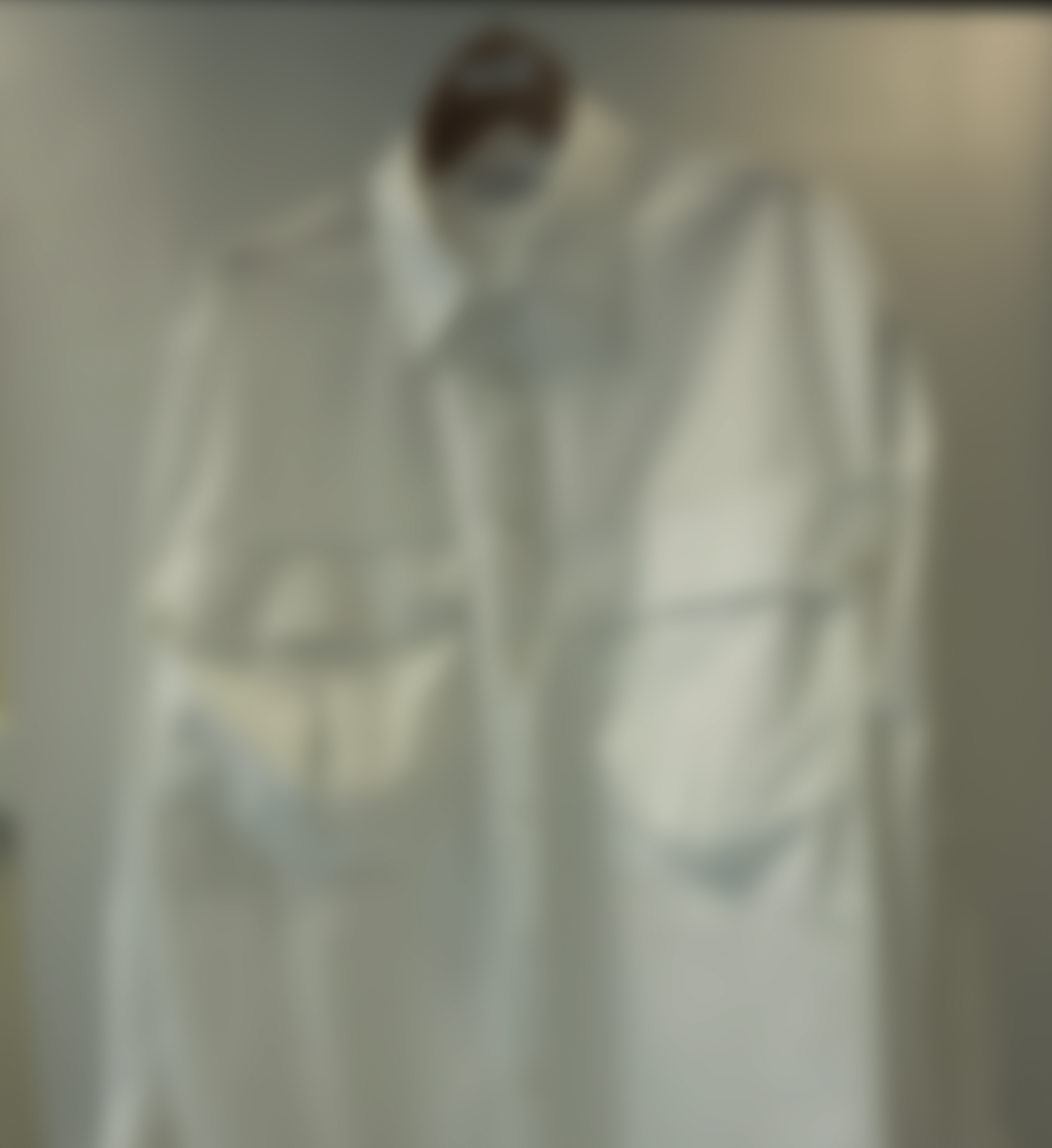 Blurred image of slouch pocket Aries Shirt.