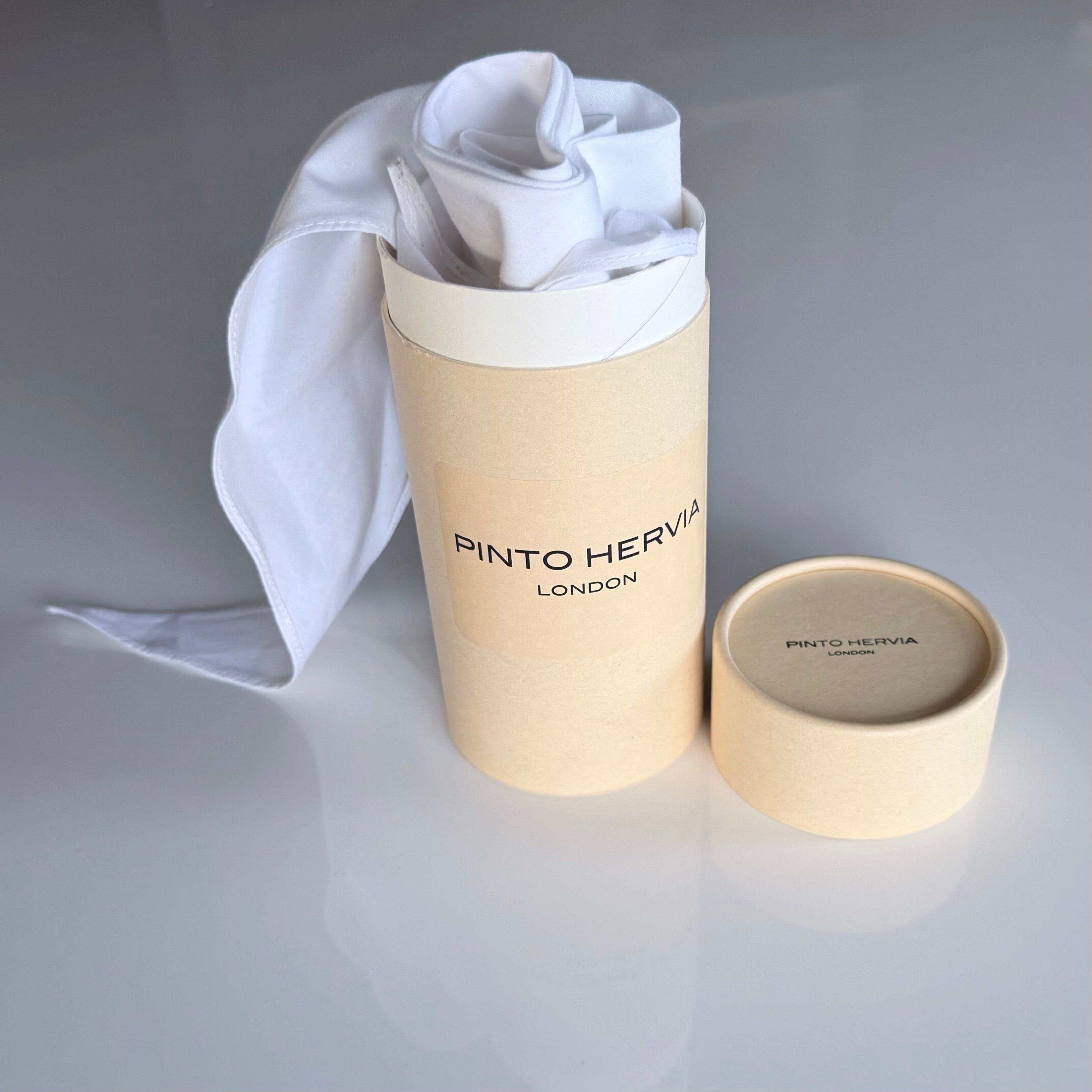 White poplin Arrombo Scarf presented with branded Pinto Hervia London packaging tube