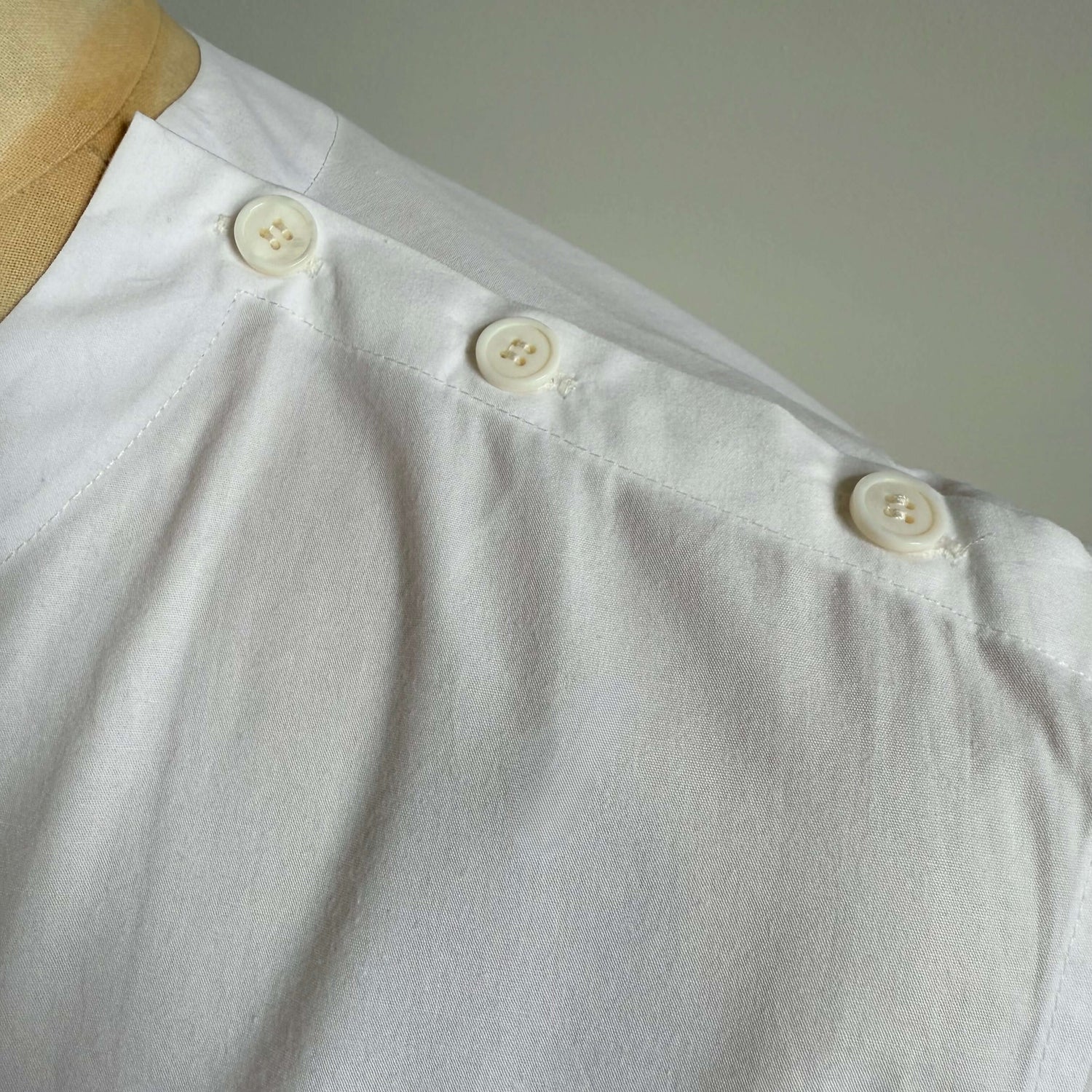 White Aries Button T-Shirt — shoulder button detail
