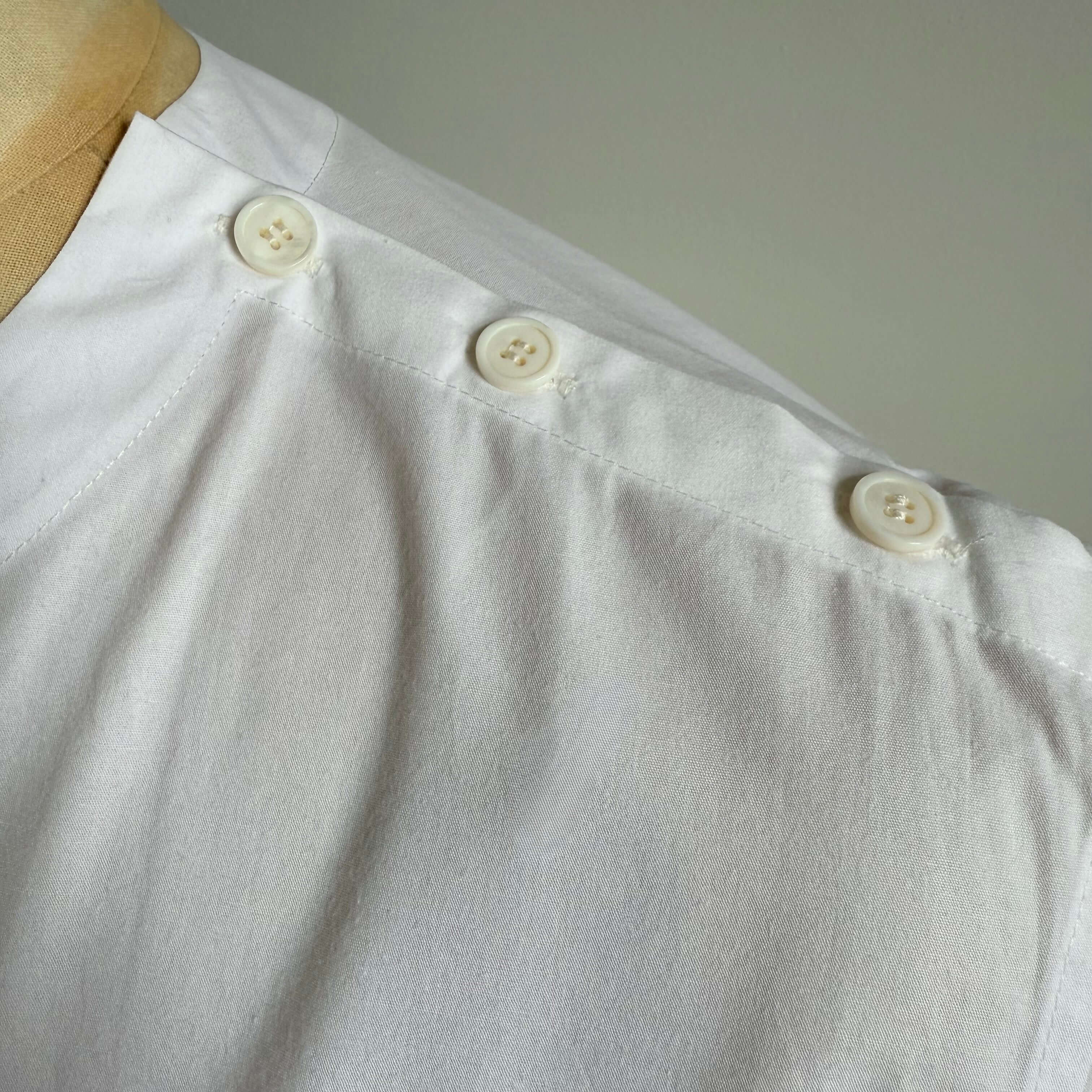White Aries Button T-Shirt — shoulder button detail
