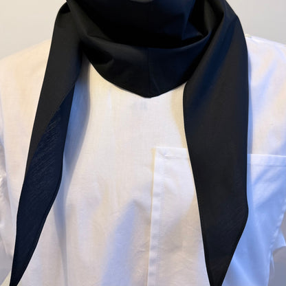 Black cotton poplin bias-cut scarf styled on model as a refined cravat fold – Arrombo Scarf