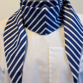 Blue striped cotton poplin bias-cut scarf styled on model in folded cravat style – Arrombo Scarf