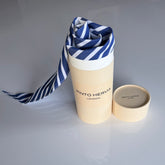 Blue striped Arrombo Scarf with branded Pinto Hervia London gift tube packaging