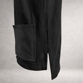 Black Atlas long sleeve jersey top with front patch pockets and extended back hem made in England side detail view.
