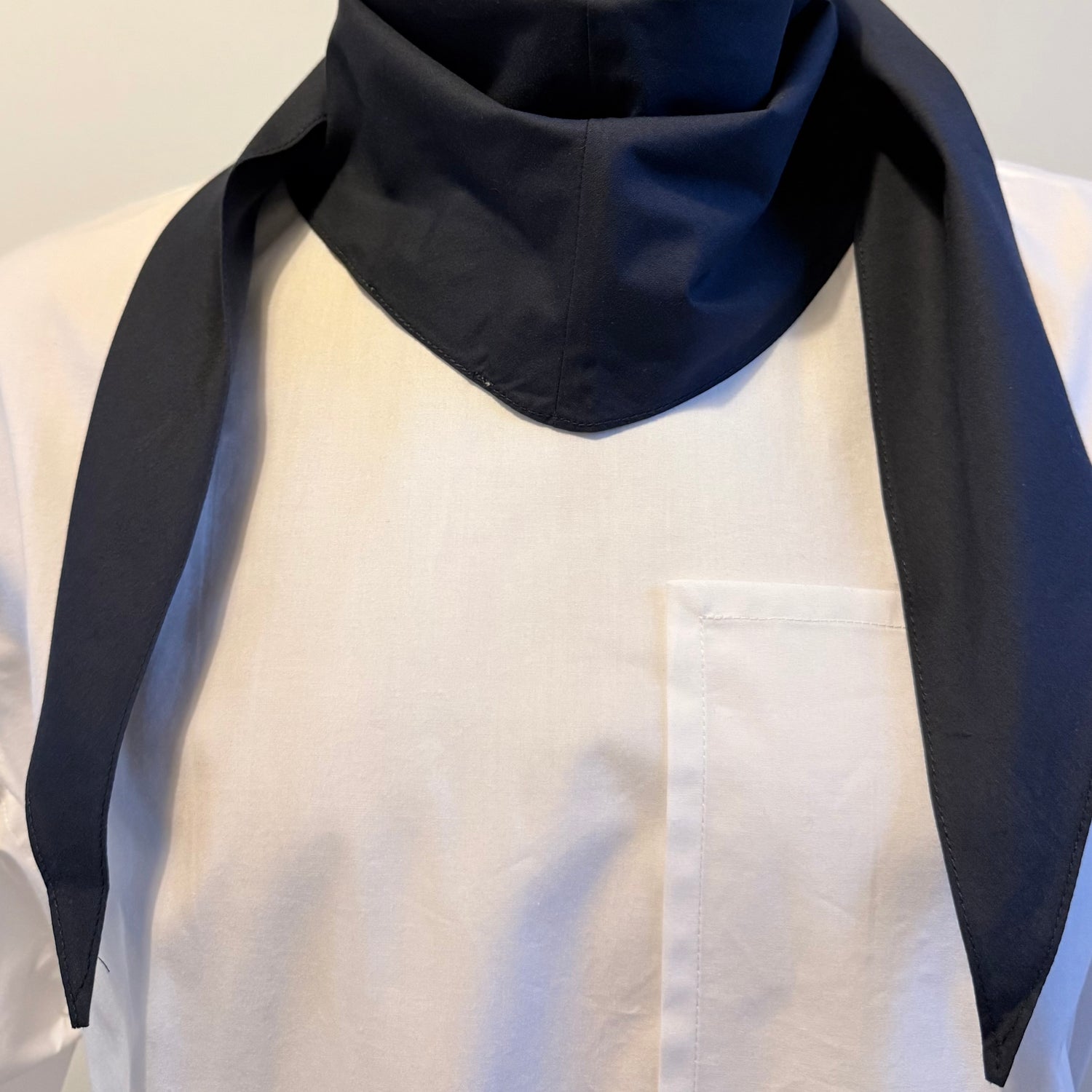 Navy cotton poplin bias-cut scarf styled on model with structured fold – Arrombo Scarf
