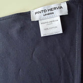 Close-up of mid-seam construction and poplin texture on navy Arrombo Scarf