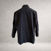 Back view of the PINTO HERVIA Frame Jacket in black cotton drill with relaxed silhouette and clean rear