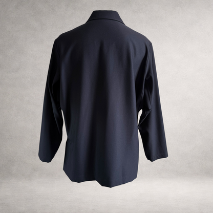 Back view of the PINTO HERVIA Frame Jacket in black wool with relaxed silhouette and clean rear
