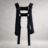 Black quilted PINTO HERVIA H-Frame harness with padded construction and metal ring hardware.
