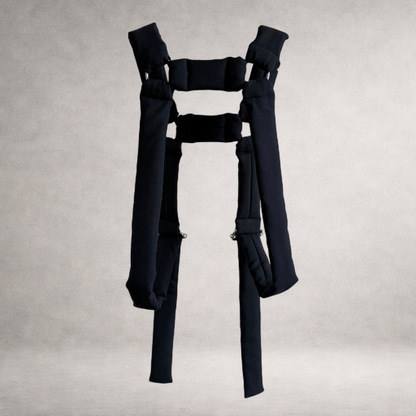 Black quilted PINTO HERVIA H-Frame harness with padded construction and metal ring hardware.