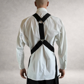 Black PINTO HERVIA Y-Vector harness with soft construction and polished metal hardware. Back view on male model.