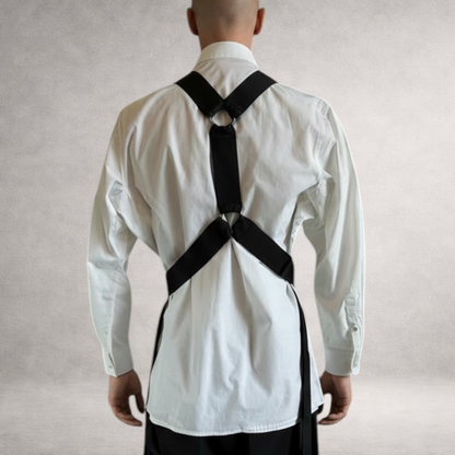 Black PINTO HERVIA Y-Vector harness with soft construction and polished metal hardware. Back view on male model.