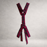Red tartan quilted PINTO HERVIA Y-Vector harness with padded construction and polished metal hardware.