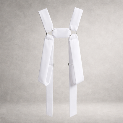 White PINTO HERVIA H-Frame harness with soft structured cotton panels and metal ring hardware.