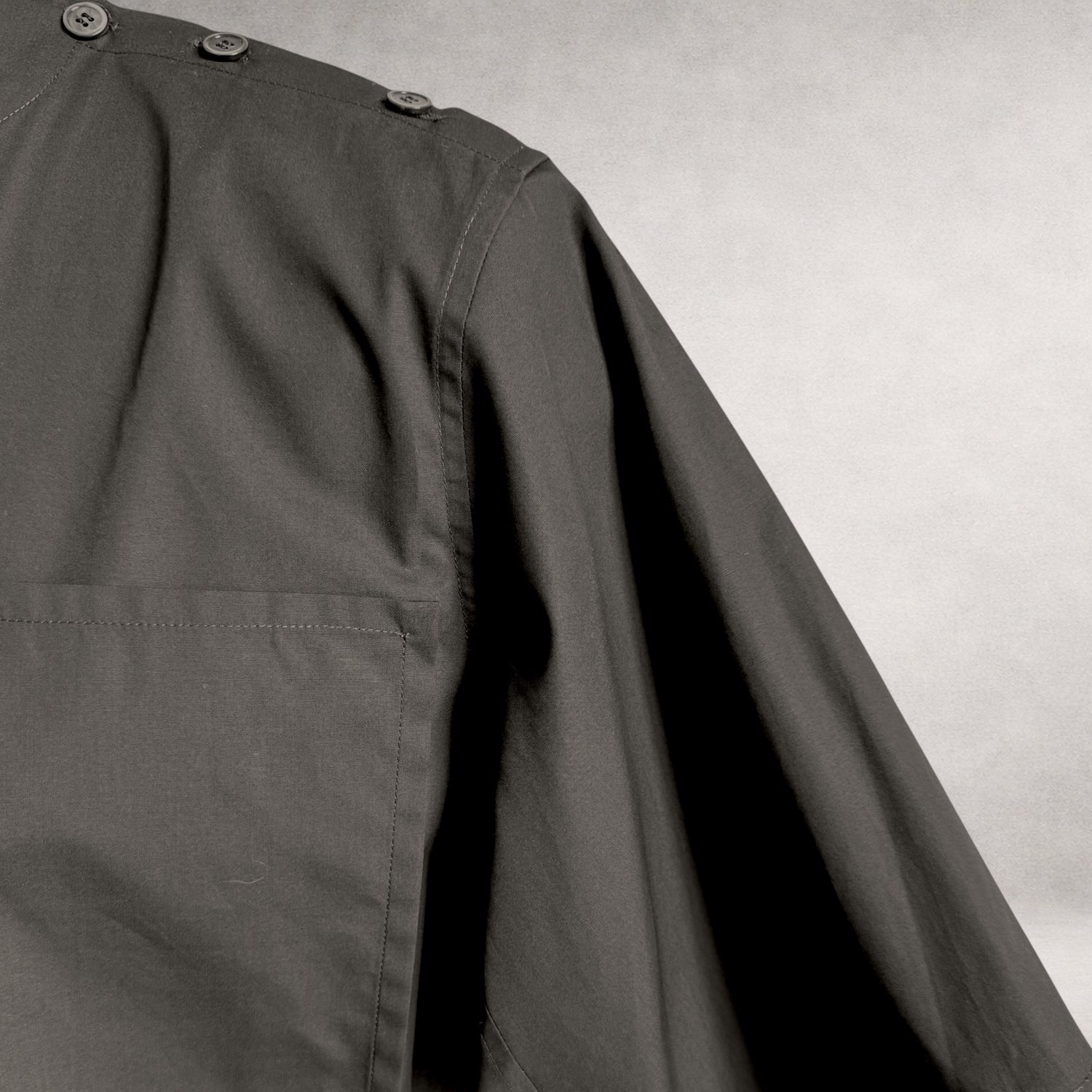 Black  Aries 4 shirt detail showing shoulder button construction