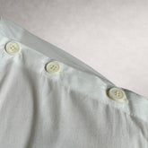 White Aries 4 shirt detail showing shoulder button construction
