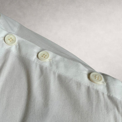 White Aries 4 shirt detail showing shoulder button construction