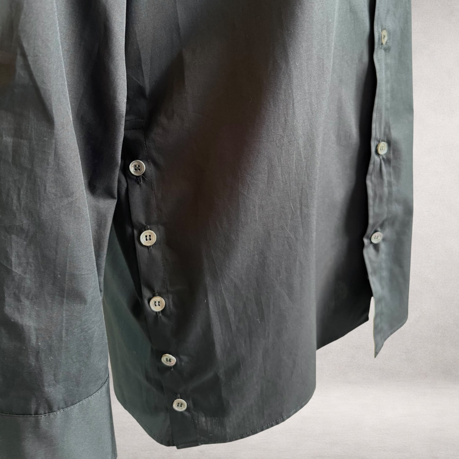Black Aries 6 shirt detail showing side button fastening
